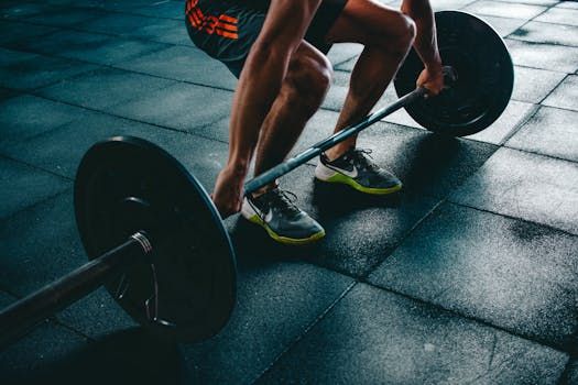 pexels-photo-841130-841130 Man performing a deadlift exercise in a gym, demonstrating strength and fitness.